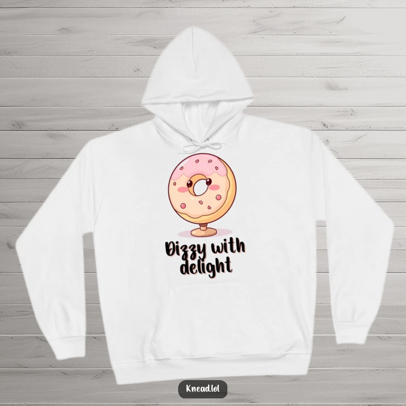 Funny donut hoodie with a blushing, plump character spinning with dotted eyes, a cozy and humorous sweatshirt.