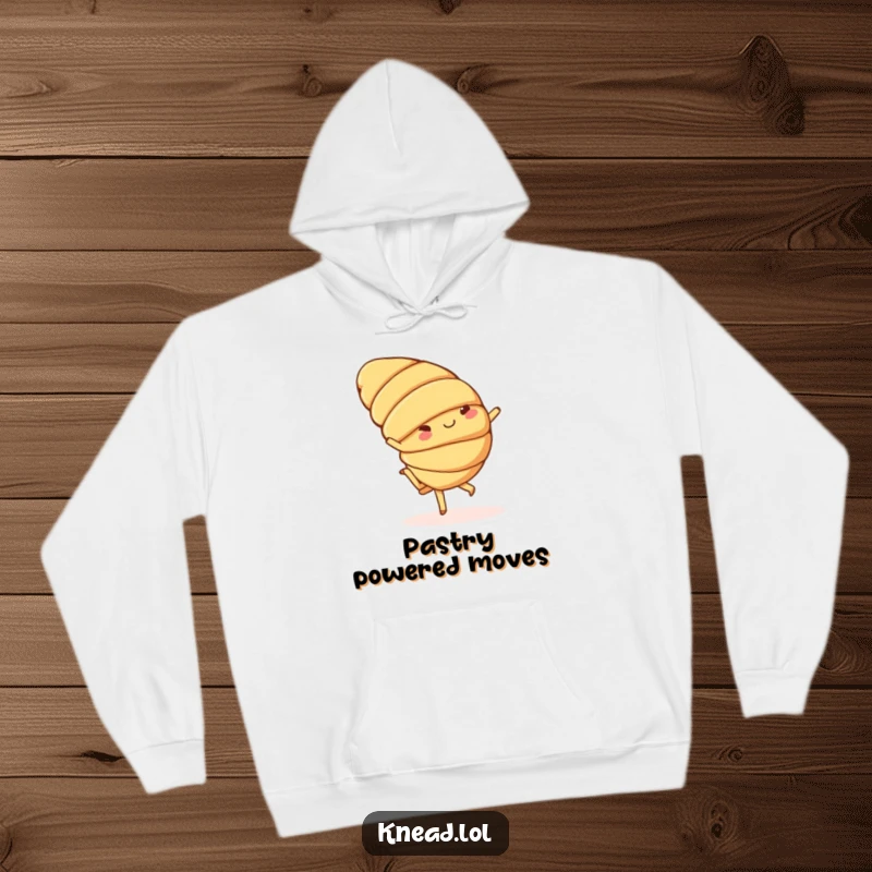 Funny hoodie depicting a cheerful croissant with small feet doing a playful cartwheel, perfect for comfortable, humorous wear.