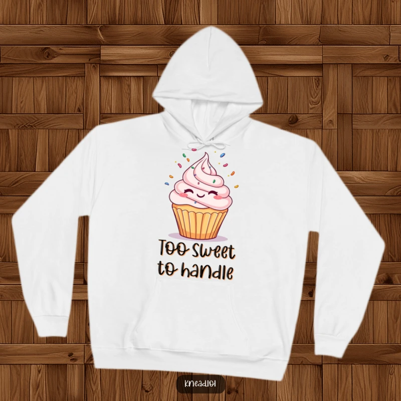 Funny Winking Cupcake Hoodie featuring a delightful cupcake character winking and juggling sprinkles, offering cozy warmth and humorous dessert charm.