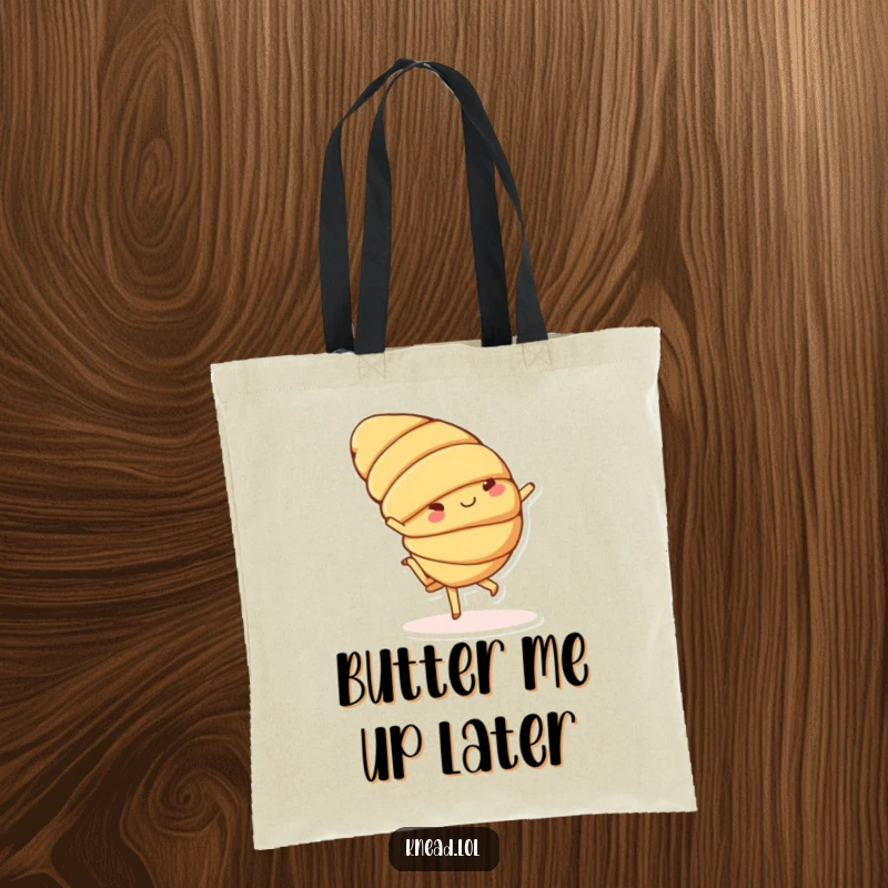Funny tote bag with a cheerful croissant character doing a playful cartwheel with small feet, a practical and amusing accessory.